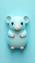 Cute blue mouse figurine on a matching blue background Royalty Free Stock Photo