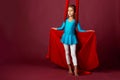 Charming little girl in a blue gymnastic suit Royalty Free Stock Photo