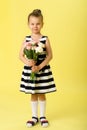 Charming little girl with bouquet of rose flowers Royalty Free Stock Photo