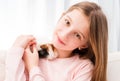Charming little girl holding guinea pig Royalty Free Stock Photo
