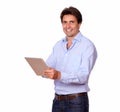 Charming male adult working on tablet pc