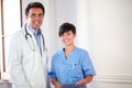 Charming male doctor and pretty nurse standing Royalty Free Stock Photo