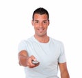 Charming man pointing with remote control Royalty Free Stock Photo