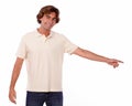 Charming man pointing to his left Royalty Free Stock Photo