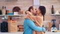 Charming couple dancing in kitchen