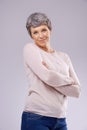 Charming maturity. Studio portrait of a happy mature woman against a white background.