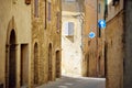 Charming medieval street of Montalcino town, located on top of a hill top and surrounded by vineyards, known worldwide for the