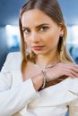 Charming model girl with gold diamond accessories on her body. Lady, with a beautiful soft skin face, looks into camera Royalty Free Stock Photo