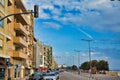 Charming narrow street, street with colorful facades of buildings, vintage style, sunny day