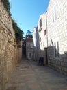 Charming narrow street in old city centre of Rab Croatia with lantern