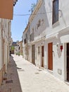 Charming narrow white-washed street of Denia, Spain