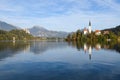 the charming natural scenery of Lake Bled with Alps at background and blue water