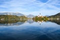 the charming natural scenery of Lake Bled with Alps at background and blue water