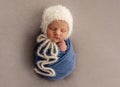 Charming newborn in knitted hat