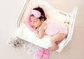 Charming newborn with pink sleep mask