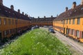 Charming old row houses in the district of Nyboder, Copenhagen, Denmark on a summer day