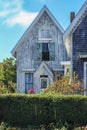 Charming old weather worn wooden cottages with Victorian bric-a-brac on Cape Cod Royalty Free Stock Photo