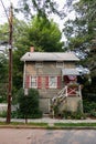 Charming Old Wood Neighborhood Home with Shutters and Green Trees in Cold Spring New York Royalty Free Stock Photo