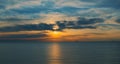 Charming orange sunrise reflecting in sea waves. Delightful seascape view. Royalty Free Stock Photo
