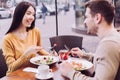 Charming pleasant couple eating dinner Royalty Free Stock Photo