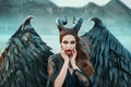 Charming portrait of dark angel with sharp horns and claws on strong powerful wings, wicked witch in black lace dress
