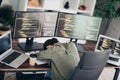 Charming professional female programmer working remotely with multiple monitors and laptops Royalty Free Stock Photo