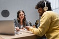 charming radio host in grey blazer Royalty Free Stock Photo