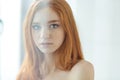 Charming redhead woman looking at camera