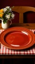 Charming retro table arrangement with a white plate, fork, and red checkered tablecloth Royalty Free Stock Photo