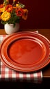 Charming retro table arrangement with a white plate, fork, and red checkered tablecloth Royalty Free Stock Photo