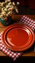 Charming retro table arrangement with a white plate, fork, and red checkered tablecloth Royalty Free Stock Photo