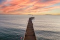 Scenery with a long pier at Ventura beach under bright sunset sky, California, USA Royalty Free Stock Photo