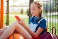 Charming schoolgirl reading great news in internet