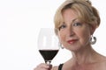 Charming Senior Woman Holding A Glass Of Red Wine