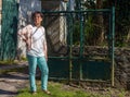 Charming senior woman standing in the park