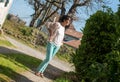 Charming senior woman standing in the park