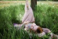 Charming Sensual Young Woman Lying On Grass With Dandelions Royalty Free Stock Photo