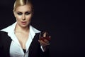 Charming smiling blond wearing white male shirt and holding a glass of brandy