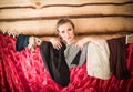 Girl peeks out from behind the wardrobe