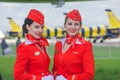 Charming Stewardess Dressed In Red Uniform. Russia, Moscow. July 2017. Royalty Free Stock Photo