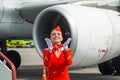 Charming Stewardess Dressed In Red Uniform. Russia, Saint-Petersburg. August 10, 2017.