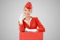 Charming Stewardess Dressed In Red Uniform And Suitcase Royalty Free Stock Photo