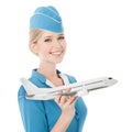 Charming Stewardess Holding Airplane In Hand. Isolated