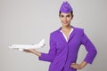 Charming Stewardess Holding Airplane In Hand.