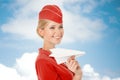 Charming Stewardess Holding Paper Plane In Hand. Royalty Free Stock Photo