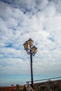 Charming Italian streetlantern with Stunning View of the blue skies in Rocca Imperiale Royalty Free Stock Photo