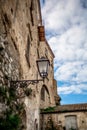 Charming Italian streetlantern hanging on a wall with Stunning View of the blue skies in Rocca Imperiale Royalty Free Stock Photo