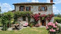 Charming stone house with lush roses and garden Royalty Free Stock Photo