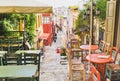 Charming street with cafe bars in old district of Plaka in Athens, Greece, popular travel destination snd tourist attraction in Eu Royalty Free Stock Photo