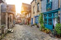 Charming street scene in an old town in Europe at sunset Royalty Free Stock Photo